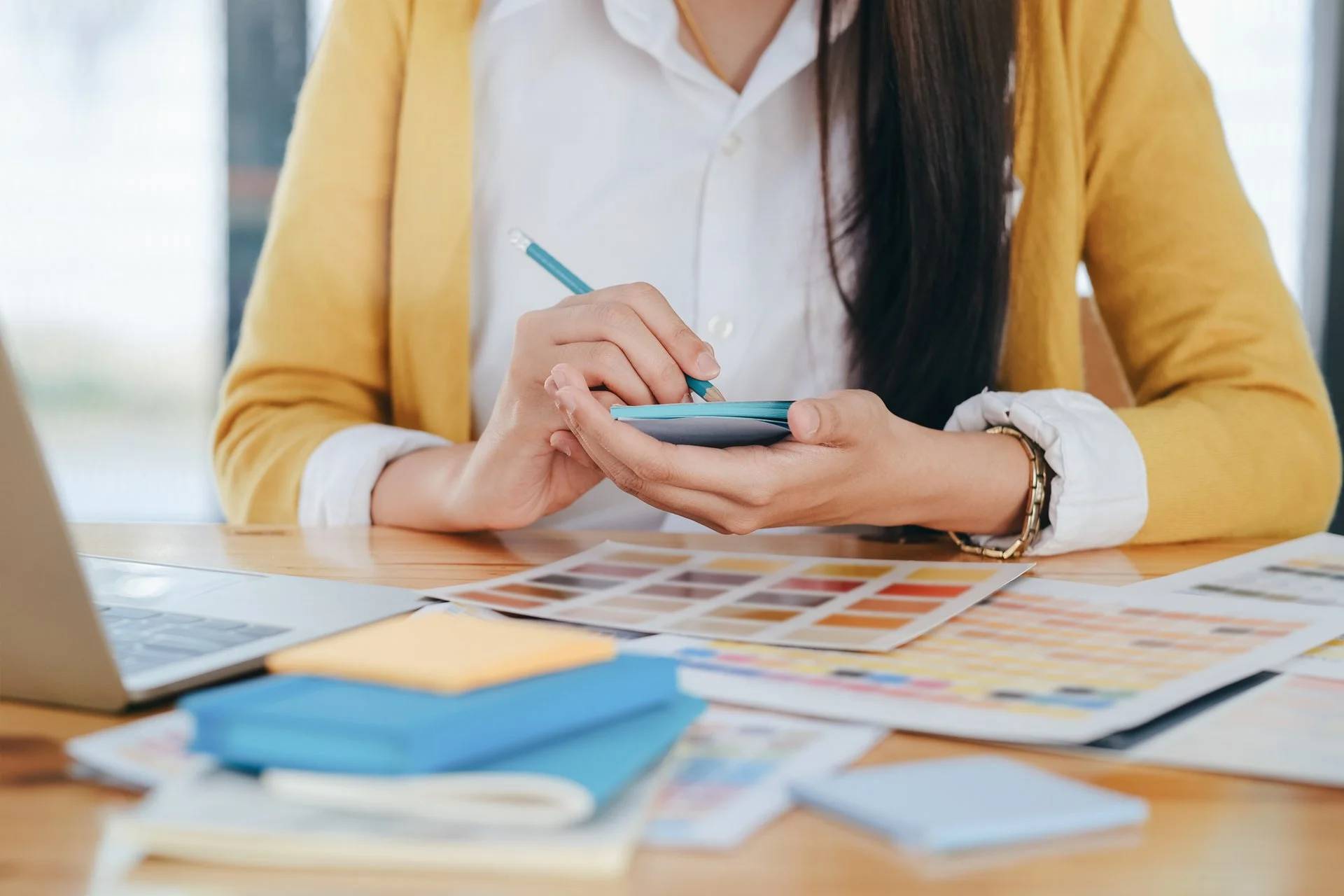 30751742 young photographer and graphic designer at work in office